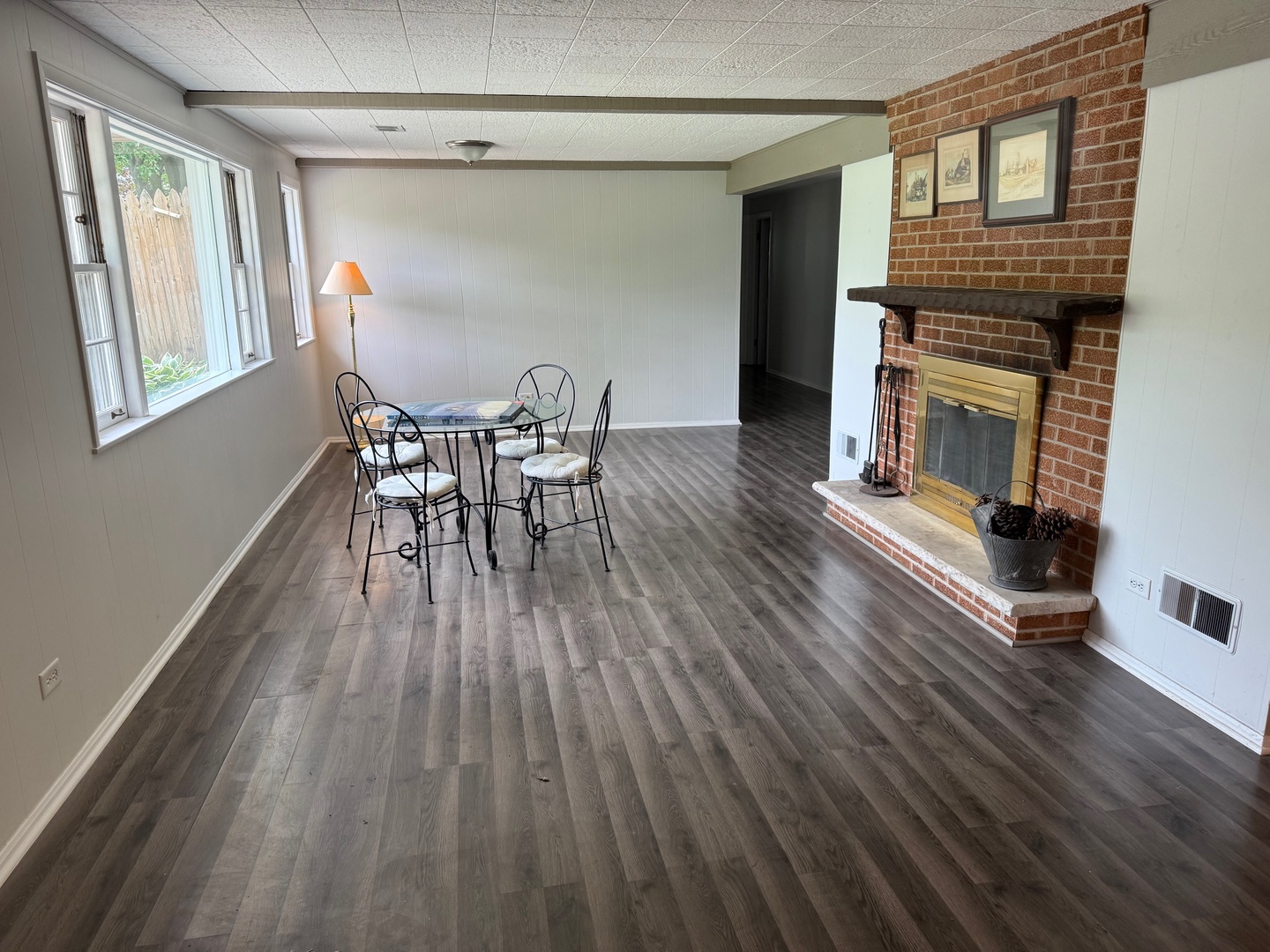 140 East Hillside Road Barrington, IL 60010 - Photo 15 of 17 a view of a dining room with furniture and a fireplace