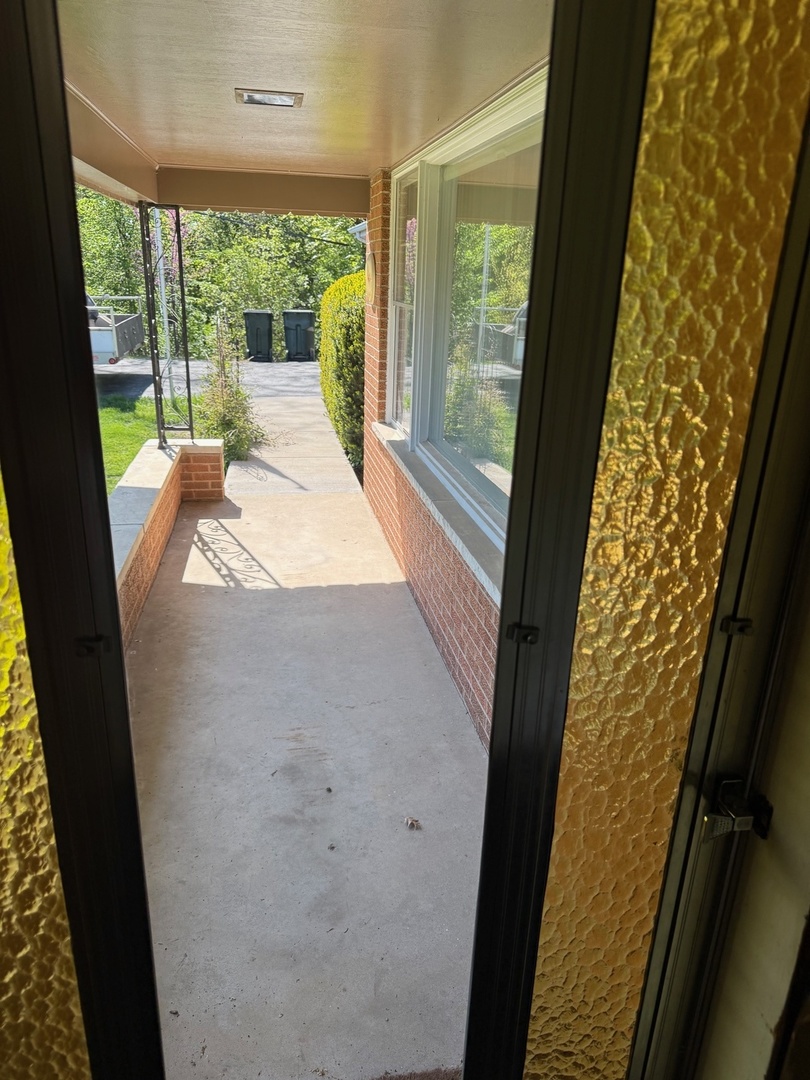 140 East Hillside Road Barrington, IL 60010 - Photo 6 of 17 a large window with swimming pool in the backyard