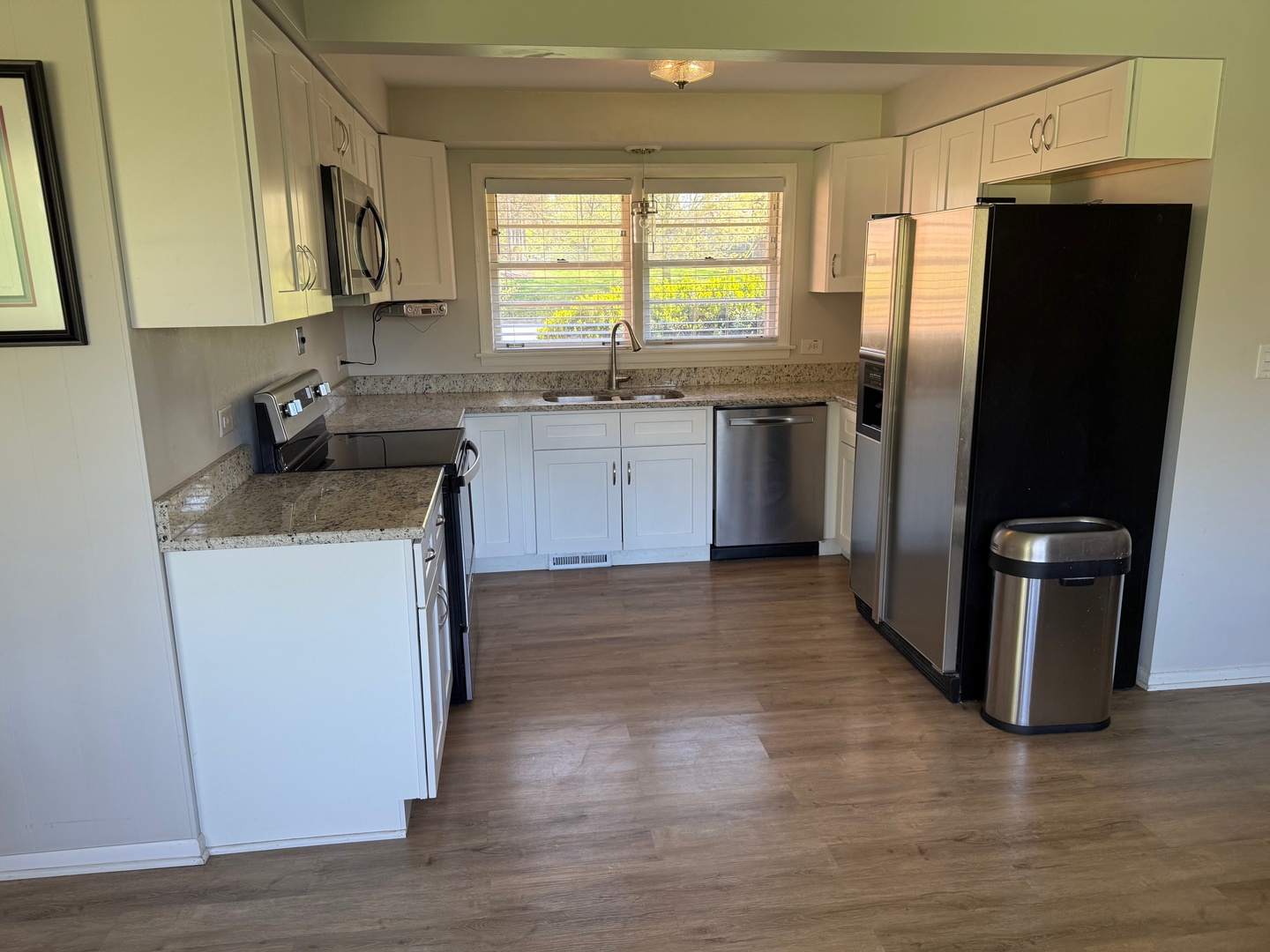 140 East Hillside Road Barrington, IL 60010 - Photo 7 of 17 a kitchen with a refrigerator sink and window