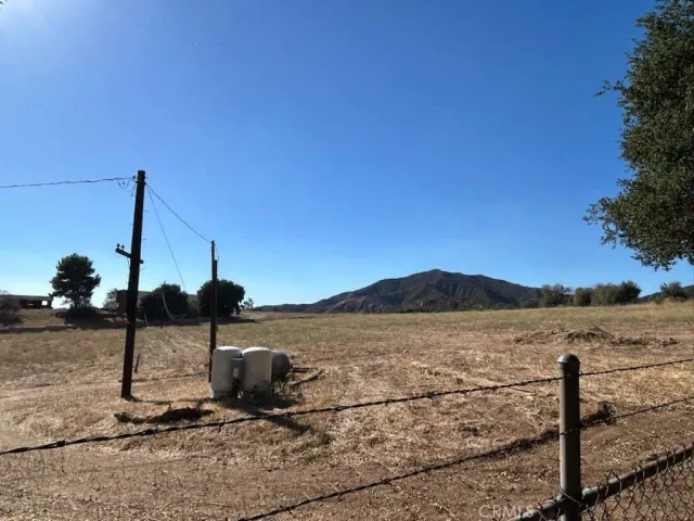 a view of a ocean next to a road