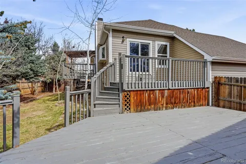 a balcony with wooden floor