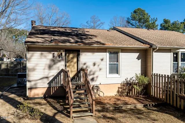 a view of a house with a small yard