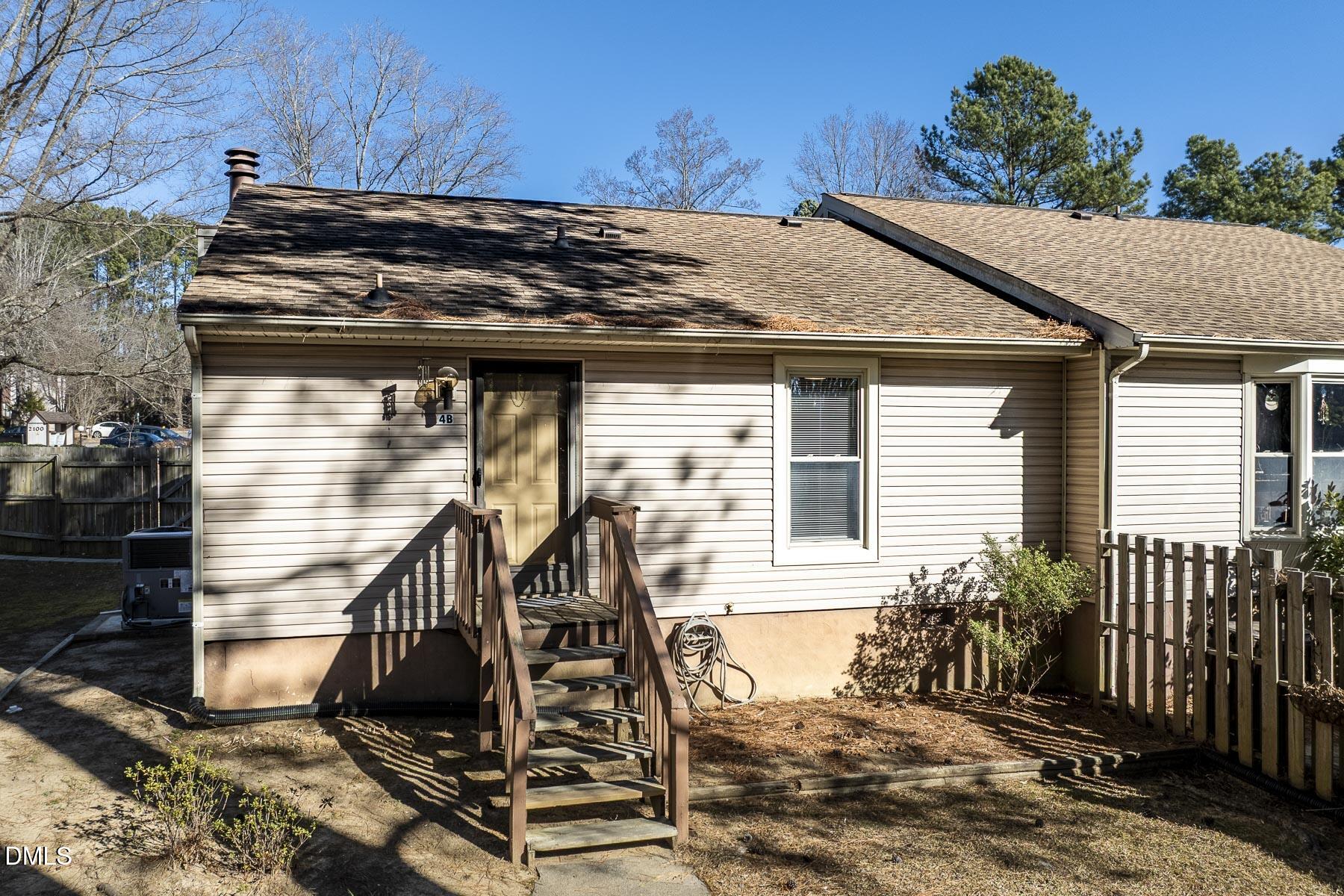 4 B Baytree Court Durham, NC 27705 - Photo 14 of 16 a view of a house with a small yard