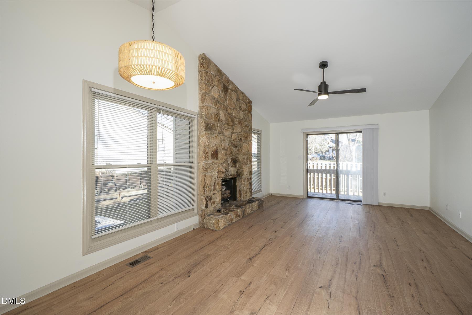 4 B Baytree Court Durham, NC 27705 - Photo 3 of 16 a view of empty room with wooden floor and fan