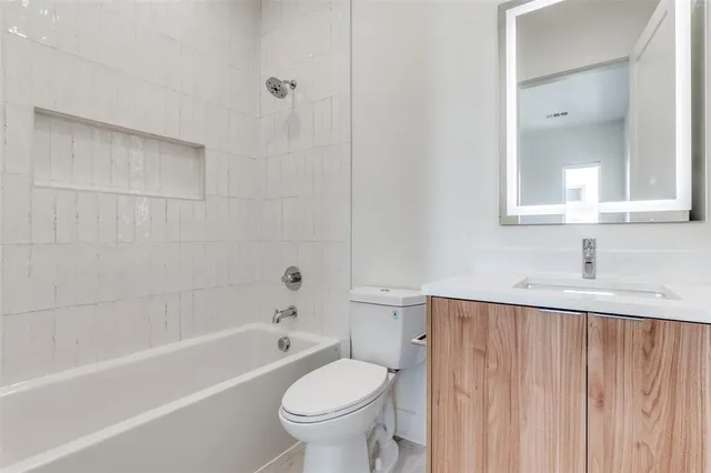 a bathroom with a sink toilet and bathtub
