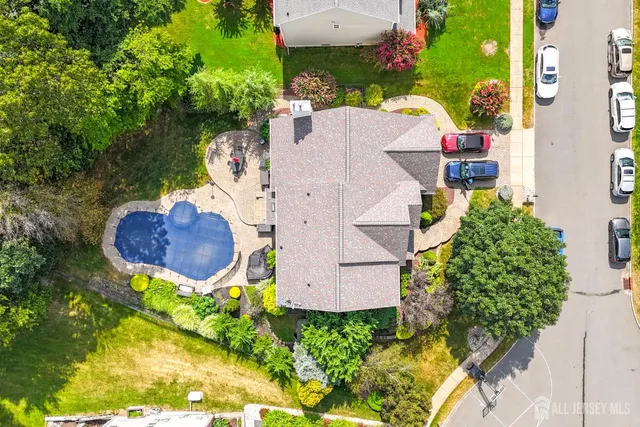 an aerial view of a house with a swimming pool
