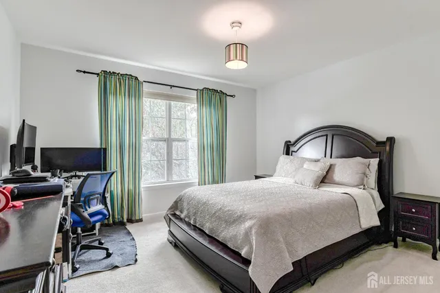 a bedroom with bed and a window