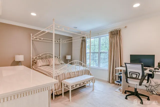 a view of walk in closet with clothes