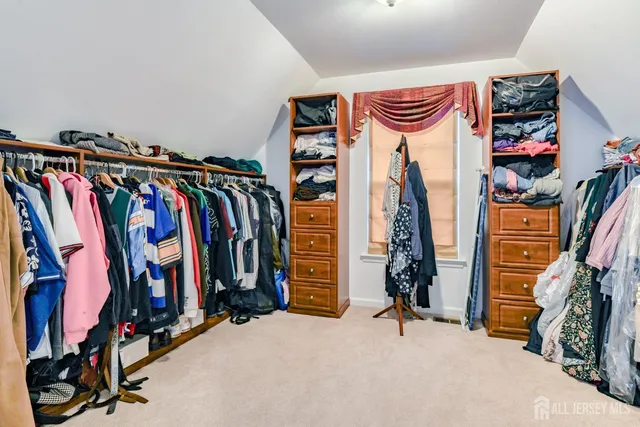 a bathroom with a sink a large mirror and a bathtub with a mirror