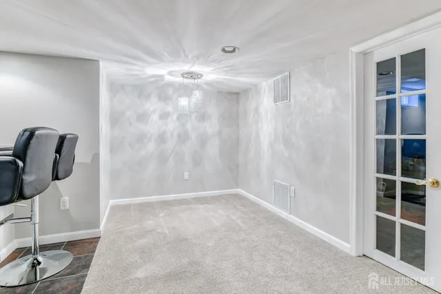 a projector room with furniture and air hockey table