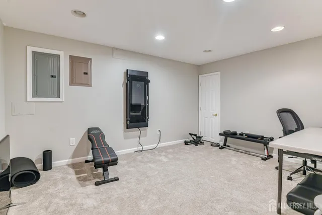 a kitchen with granite countertop a refrigerator and a sink