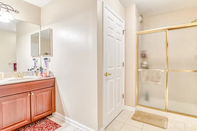 a kitchen with a refrigerator and a sink
