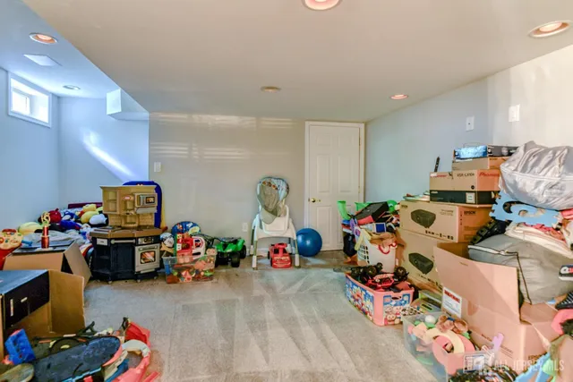 a view of patio with couches and pool