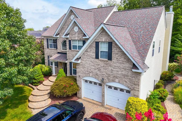 a aerial view of a house with table and chairs potted plants