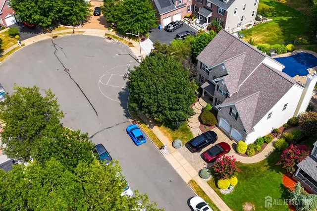 an aerial view of a house with a swimming pool