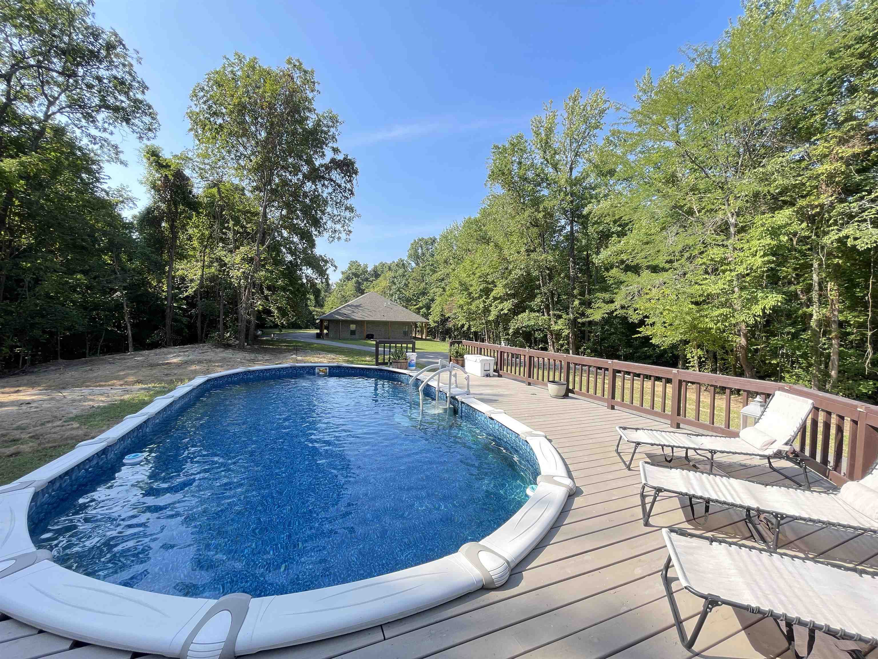 a view of a swimming pool with a patio