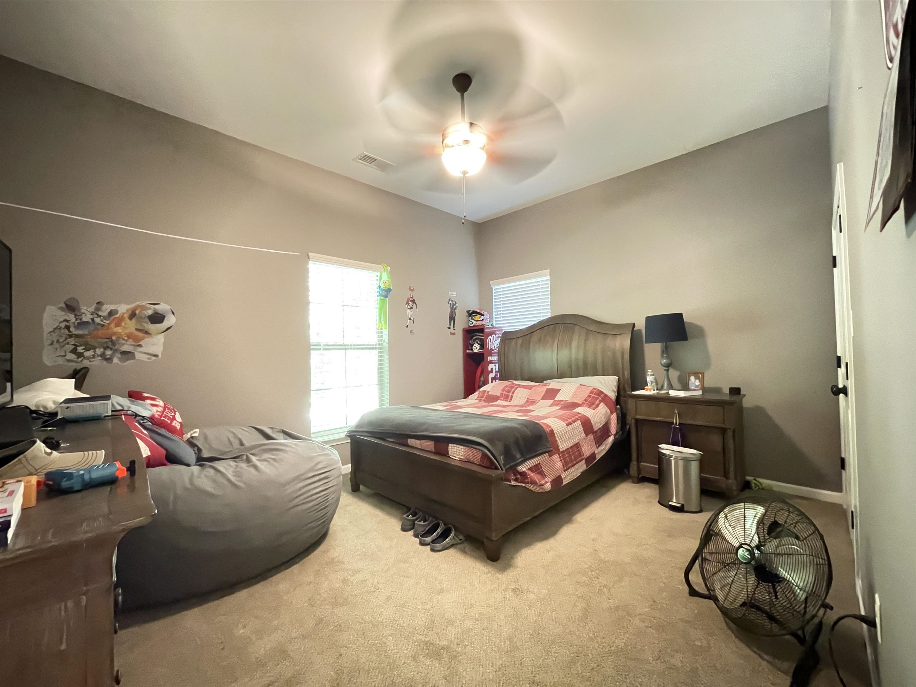 16691 Highway 59 Drummonds, TN 38023 - Photo 24 of 40 a bedroom with a bed and a chandelier