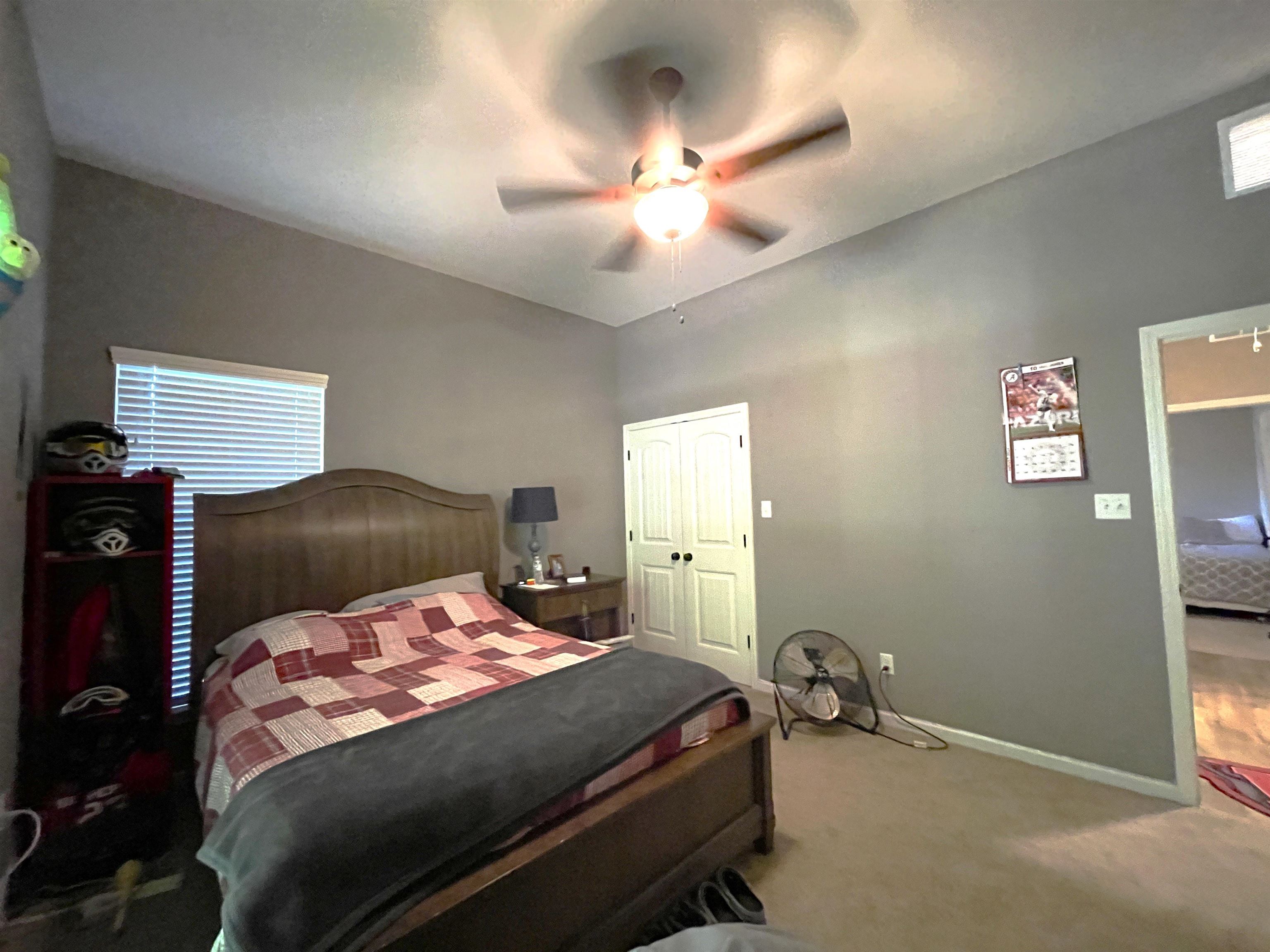 16691 Highway 59 Drummonds, TN 38023 - Photo 25 of 40 a bedroom with a bed and a chandelier