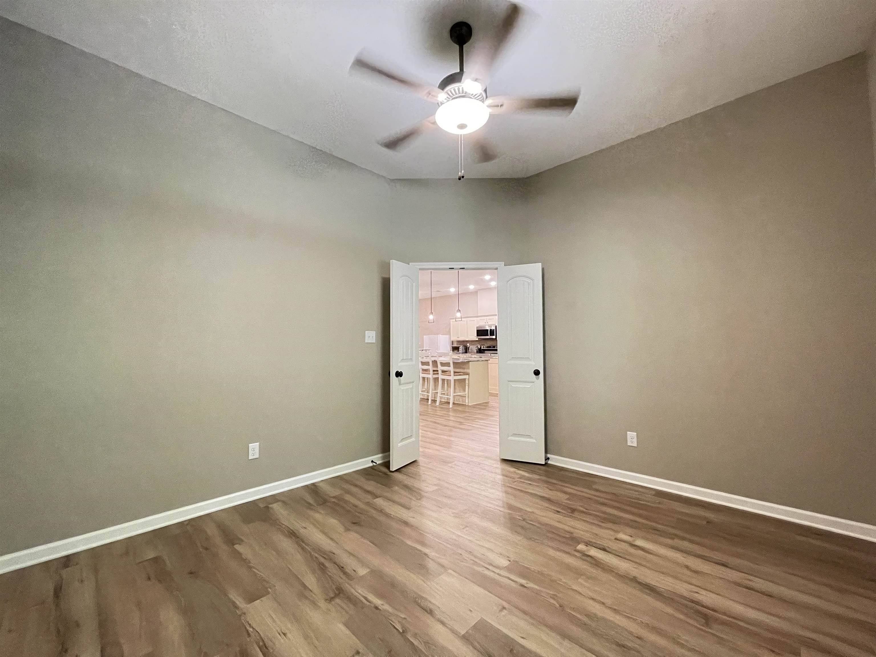 16691 Highway 59 Drummonds, TN 38023 - Photo 29 of 40 wooden floor in an empty room