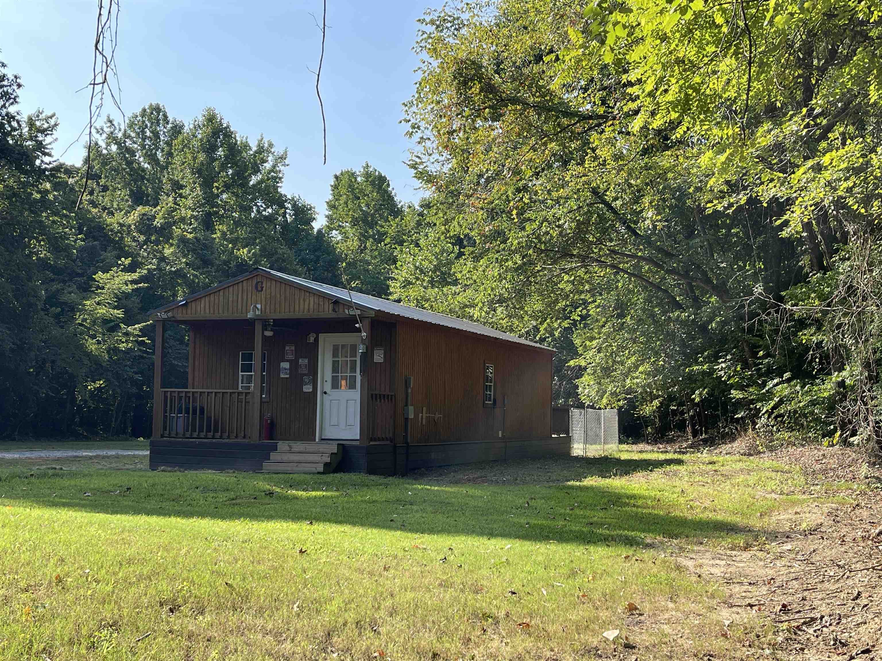 16691 Highway 59 Drummonds, TN 38023 - Photo 30 of 40 a view of a tiny house with a yard