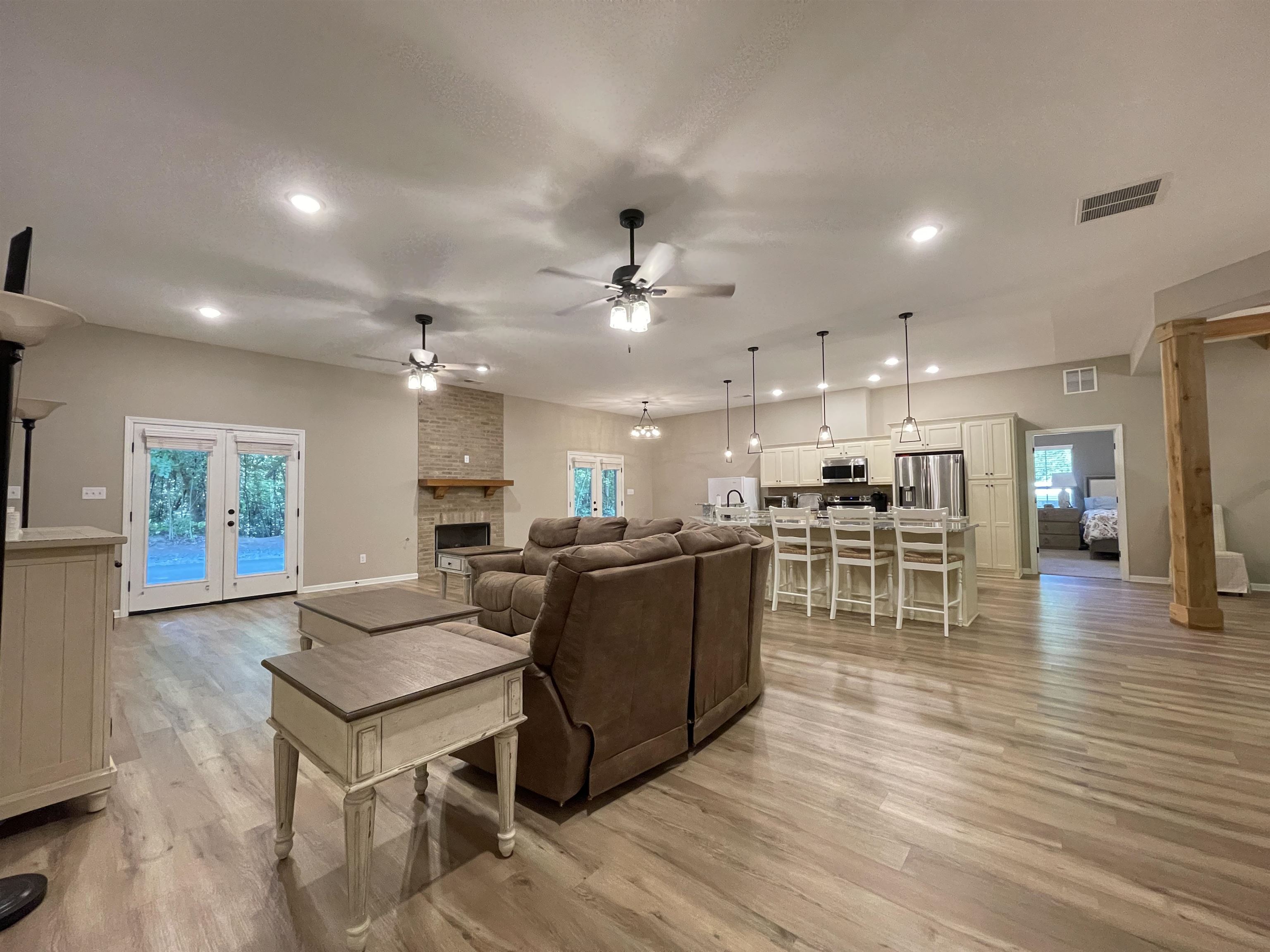 16691 Highway 59 Drummonds, TN 38023 - Photo 3 of 40 a living room with furniture and kitchen view