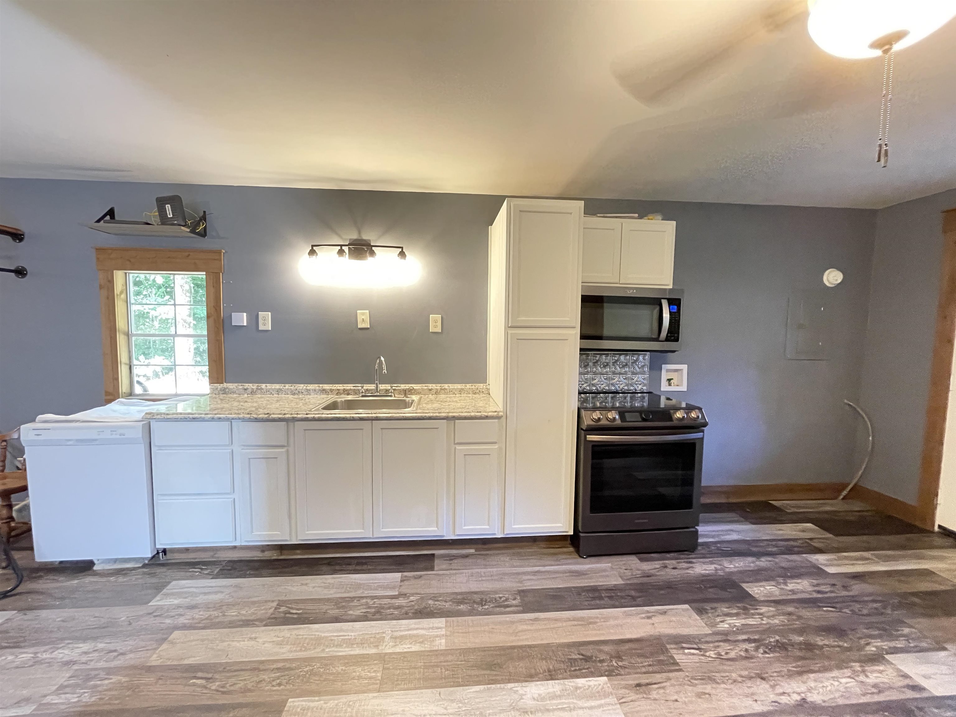 16691 Highway 59 Drummonds, TN 38023 - Photo 32 of 40 a view of kitchen with sink window and stainless steel appliances