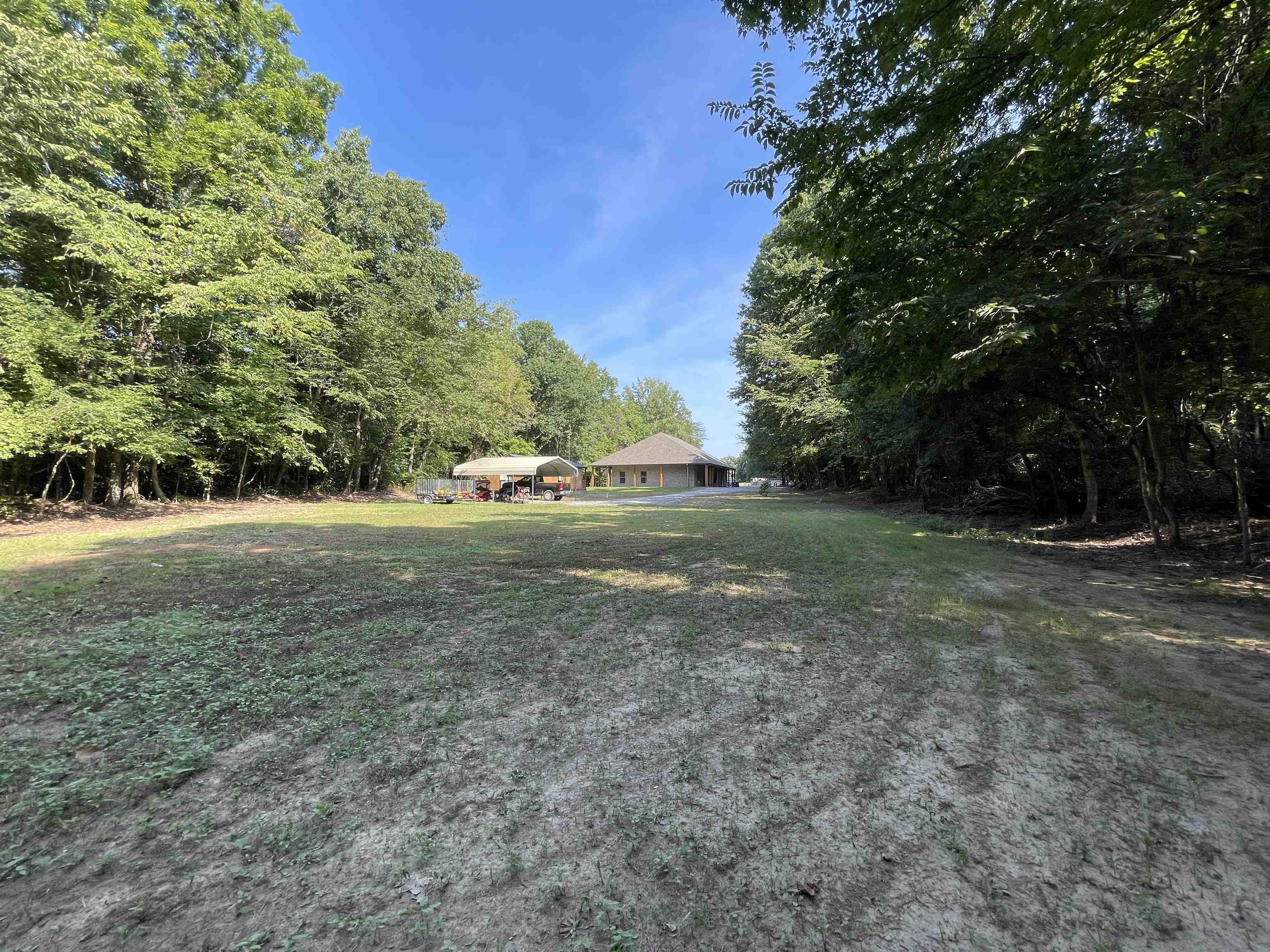 16691 Highway 59 Drummonds, TN 38023 - Photo 34 of 40 a view of outdoor space with trees all around