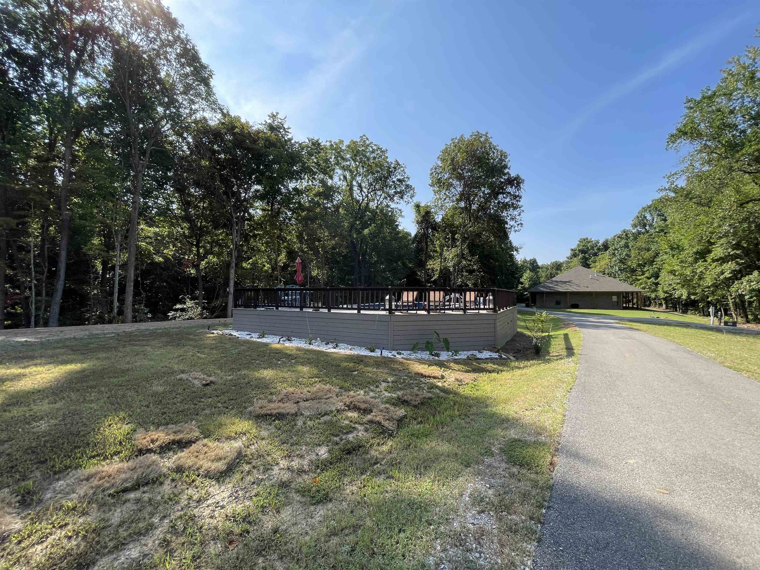 16691 Highway 59 Drummonds, TN 38023 - Photo 35 of 40 a view of a swimming pool with a yard