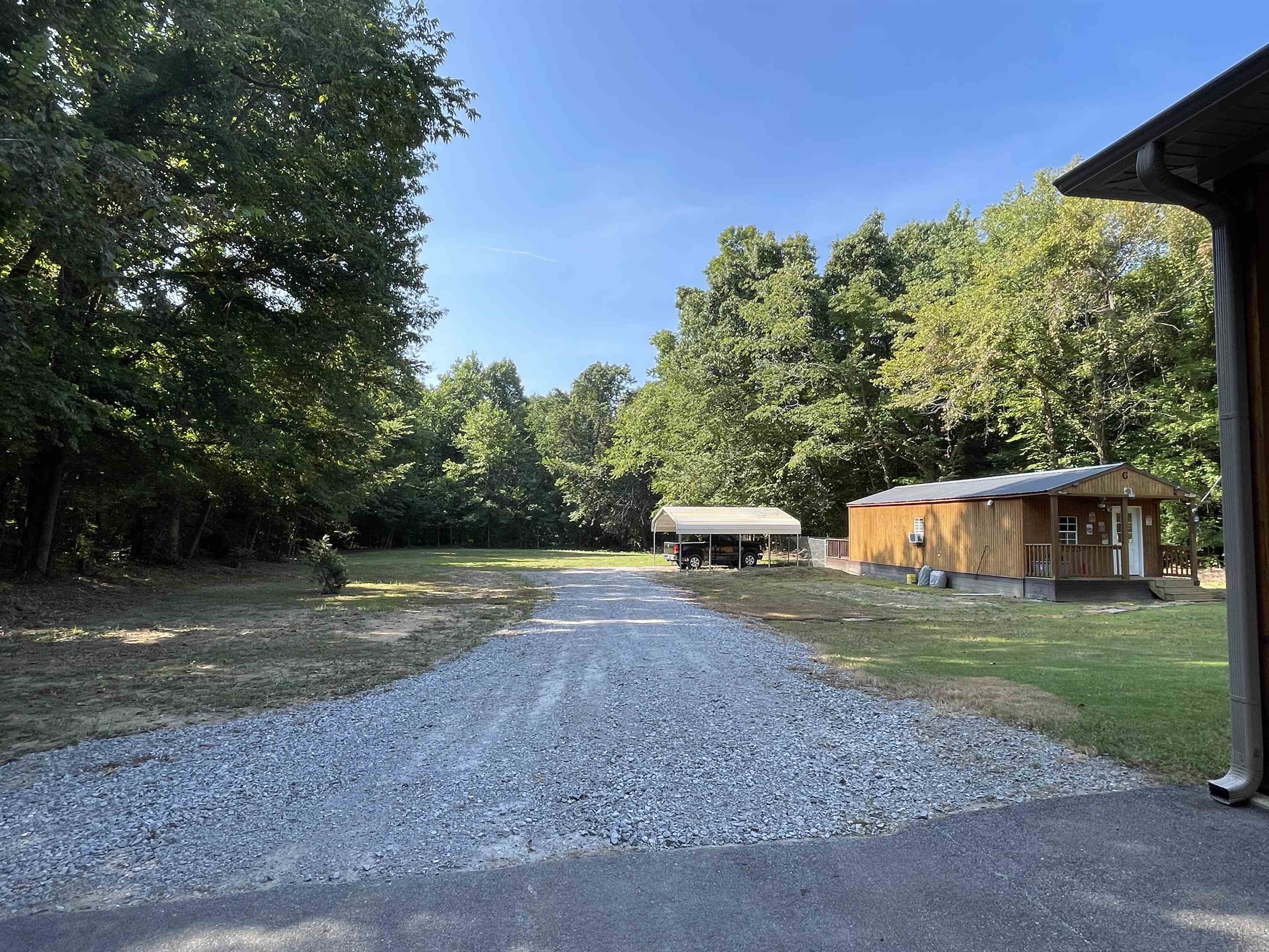 16691 Highway 59 Drummonds, TN 38023 - Photo 36 of 40 a view of a yard with of swings and slides