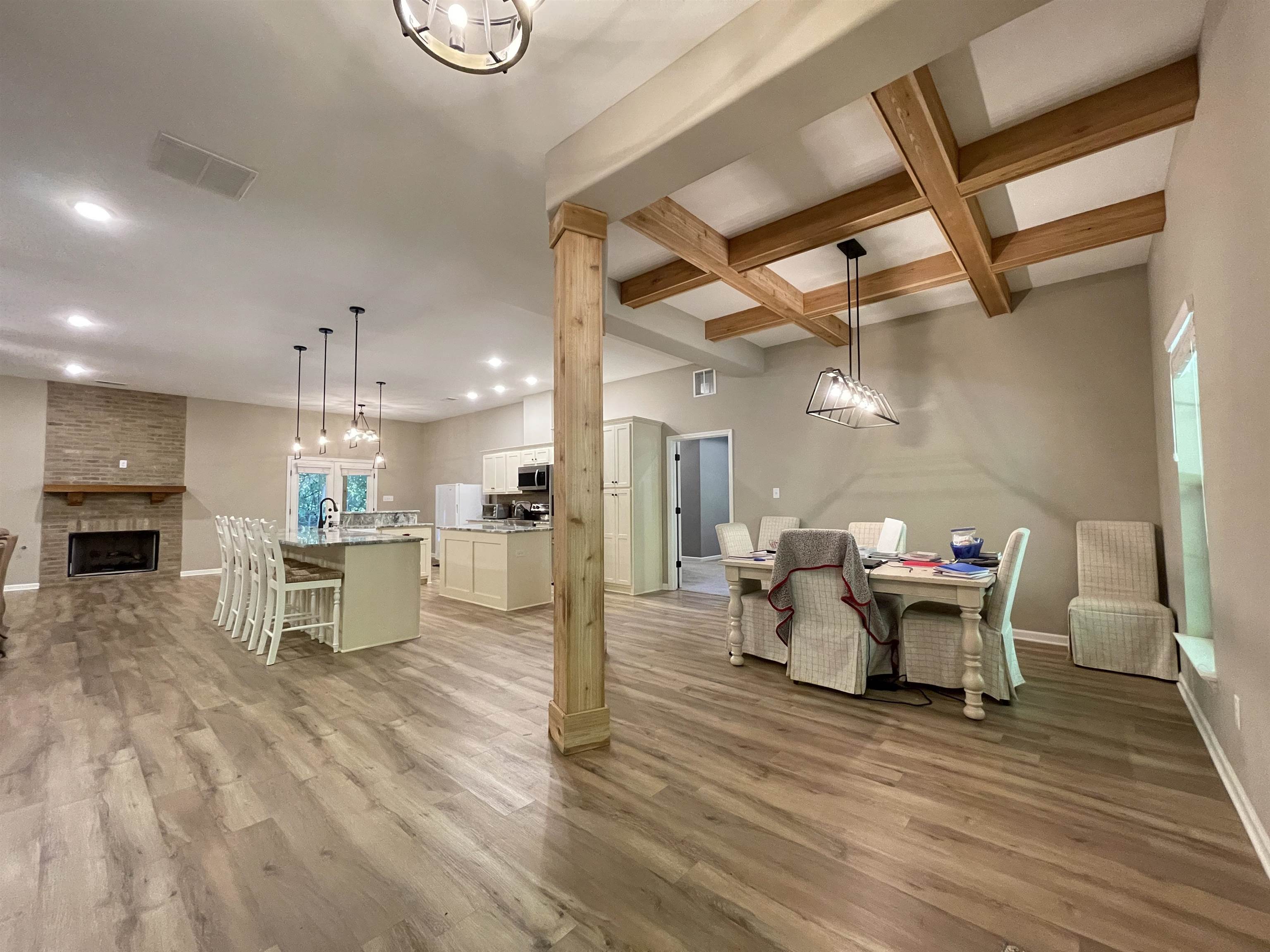 16691 Highway 59 Drummonds, TN 38023 - Photo 4 of 40 a view of a dining room with furniture a kitchen and chandelier