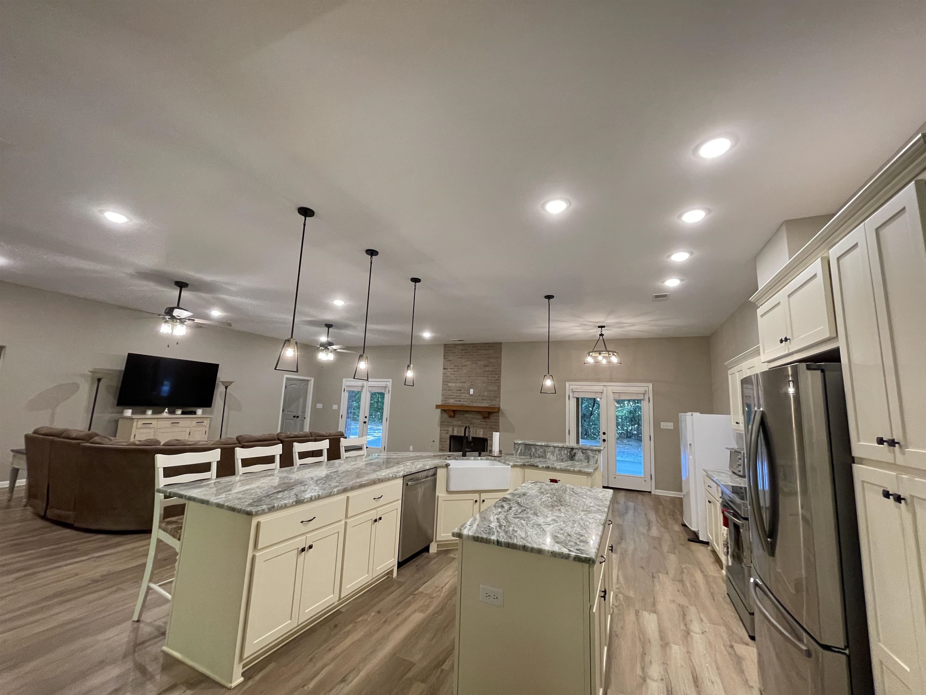 16691 Highway 59 Drummonds, TN 38023 - Photo 5 of 40 a large kitchen with kitchen island a sink stainless steel appliances and cabinets
