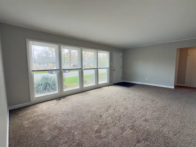 an empty room with a large window