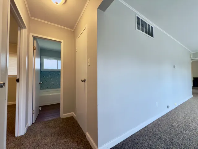 a view of a hallway with closet