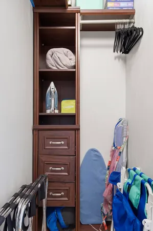 a view of storage and utility room with racks on the wall