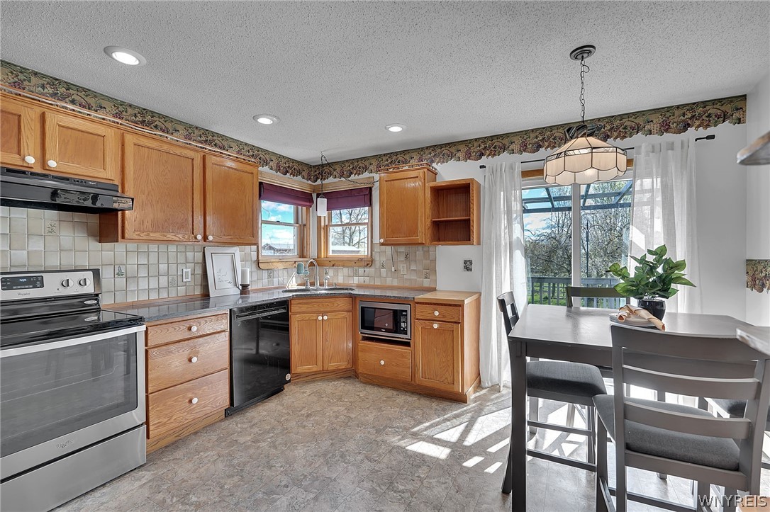 10259 Warner Gulf Road Sardinia, NY 14080 - Photo 11 of 29 KITCHEN WITH DOORS TO DECK
