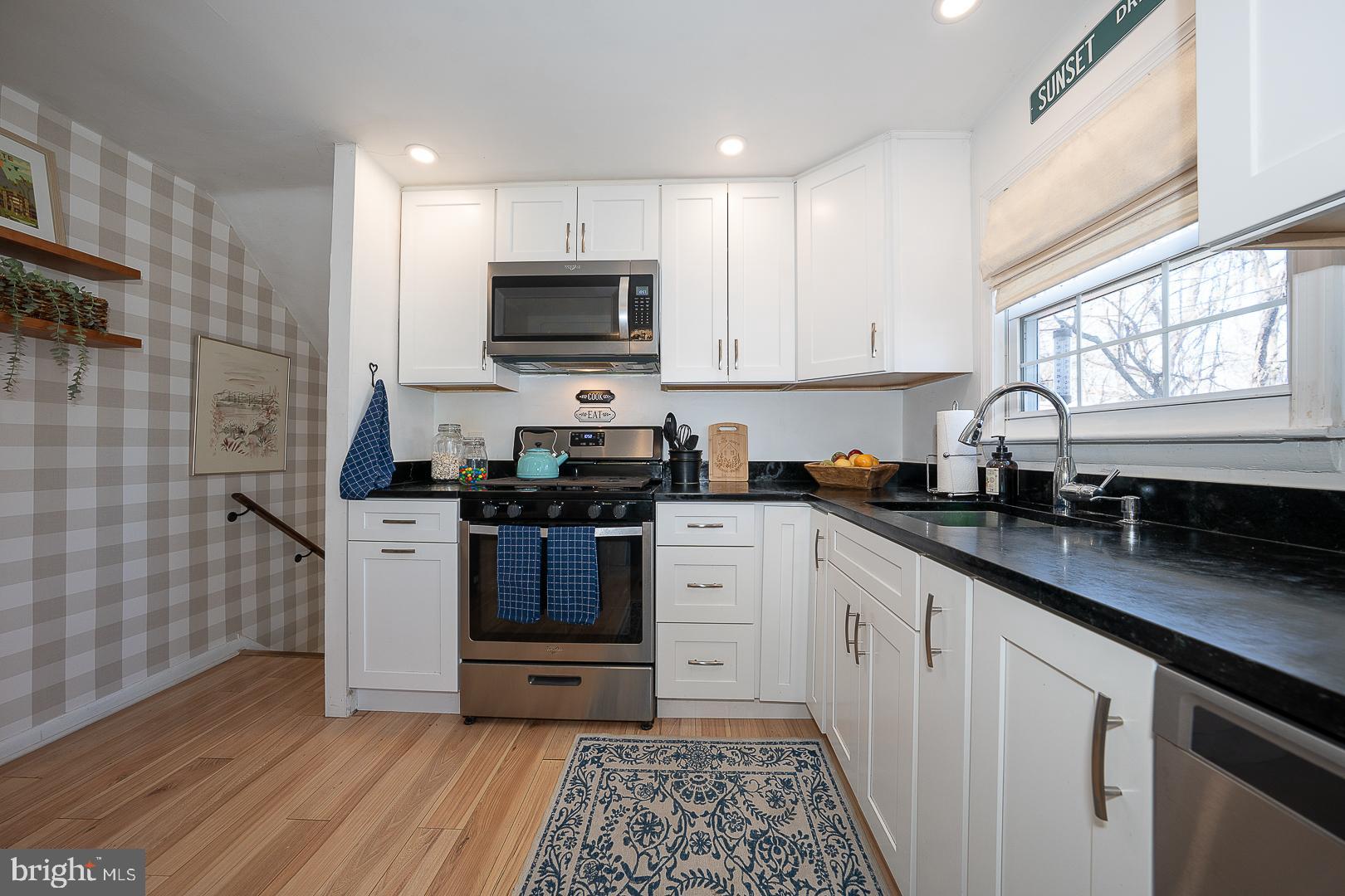 36 Sunset Drive Paoli, PA 19301 - Photo 21 of 69 a kitchen with stainless steel appliances a sink a stove a microwave and cabinetry
