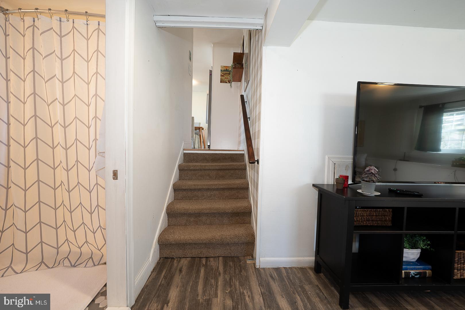 36 Sunset Drive Paoli, PA 19301 - Photo 25 of 69 a view of a hallway with wooden floor and staircase