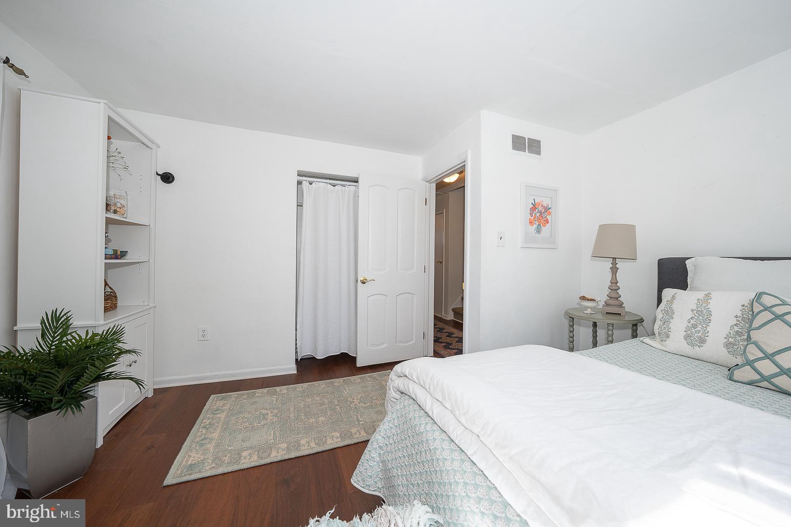 36 Sunset Drive Paoli, PA 19301 - Photo 39 of 69 a bedroom with a large bed and a potted plant