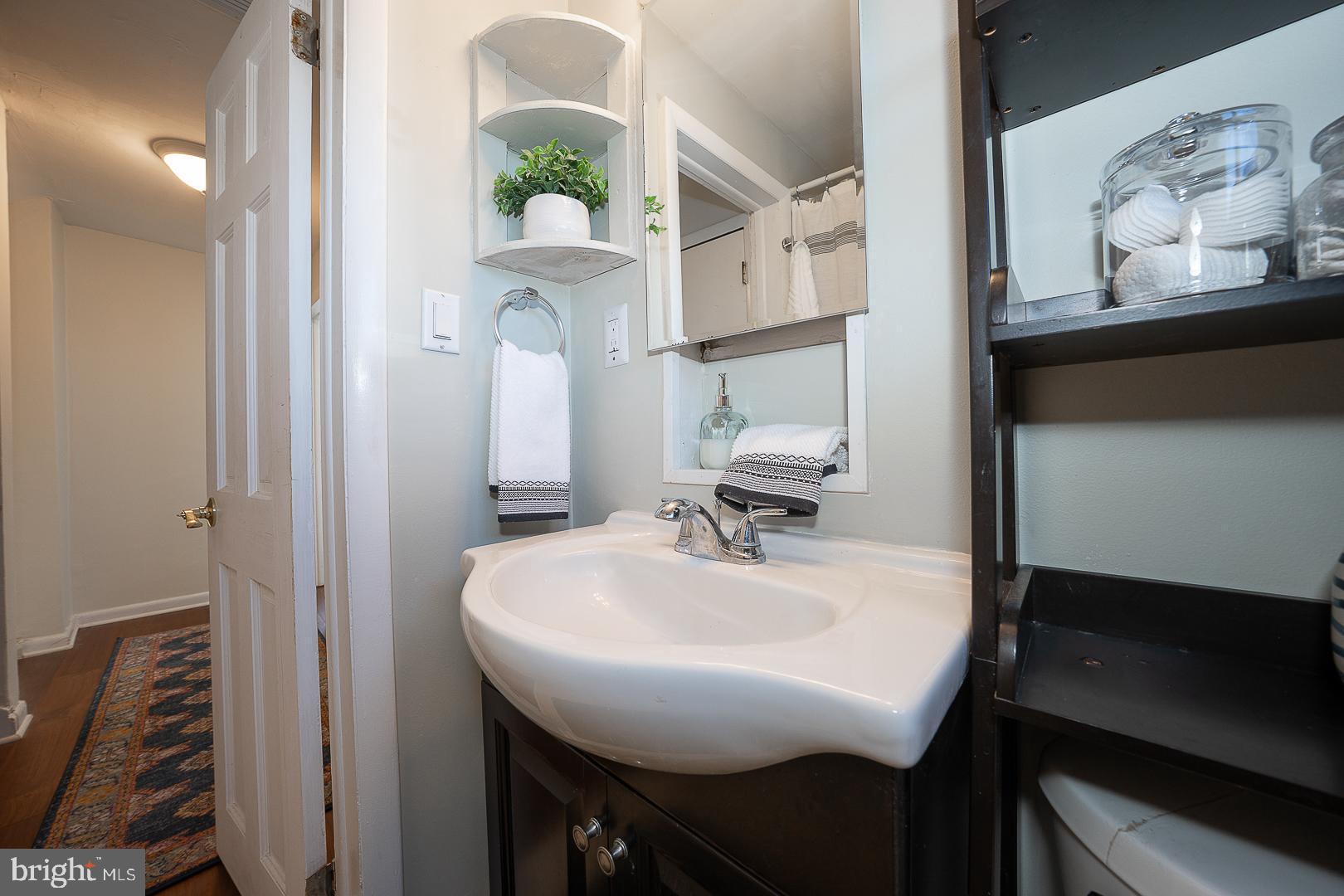 36 Sunset Drive Paoli, PA 19301 - Photo 45 of 69 a bathroom with a sink and a mirror