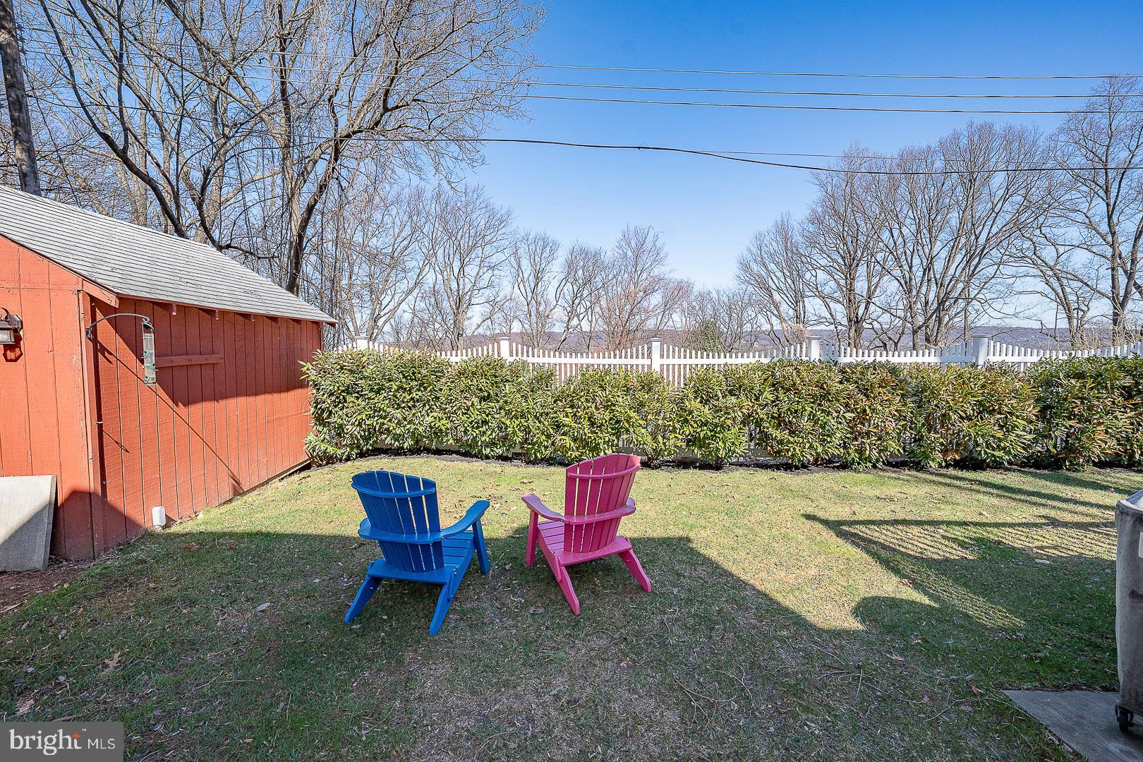 36 Sunset Drive Paoli, PA 19301 - Photo 63 of 69 a backyard of a house with table and chairs
