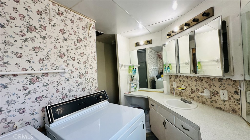 14352 Beach, Unit 95 Westminster, CA 92683 - Photo 5 of 12 a bathroom with a sink and a mirror