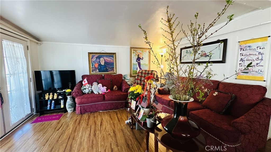 14352 Beach, Unit 95 Westminster, CA 92683 - Photo 6 of 12 a living room with furniture and wooden floor