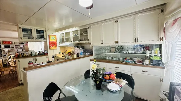 a kitchen with stainless steel appliances kitchen island granite countertop a sink and cabinets