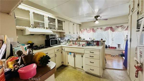 a kitchen with a sink and cabinets