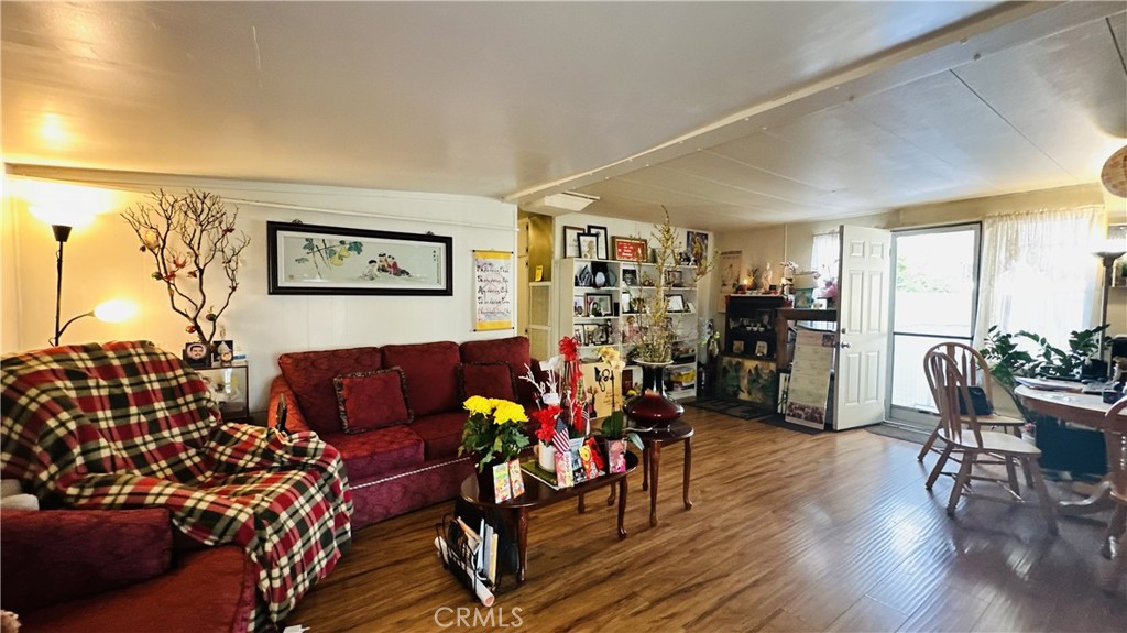 14352 Beach, Unit 95 Westminster, CA 92683 - Photo 9 of 12 a living room with furniture and wooden floor