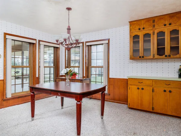 a view of a livingroom with furniture window and wooden floor
