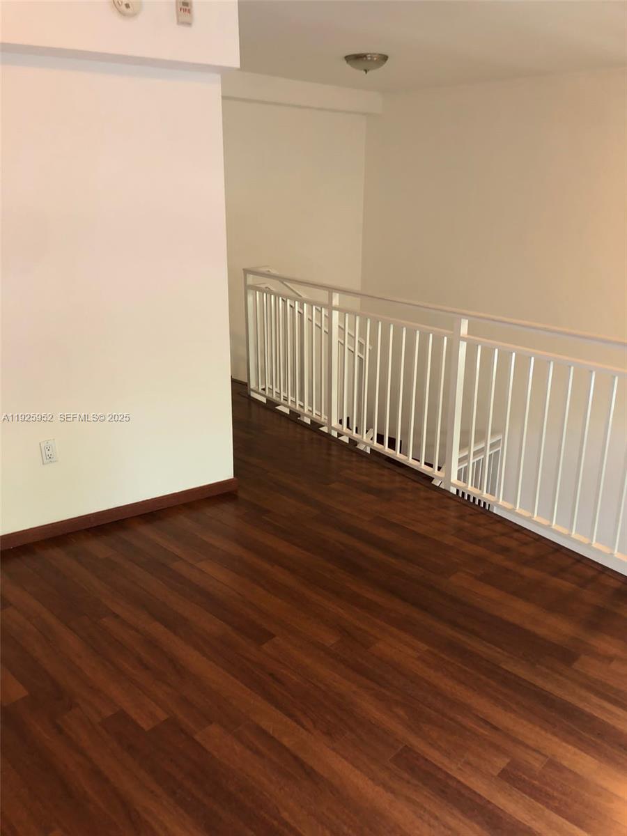 1650 Brickell Avenue, Unit 111 Miami, FL 33129 - Photo 14 of 23 a view of a room with wooden floor