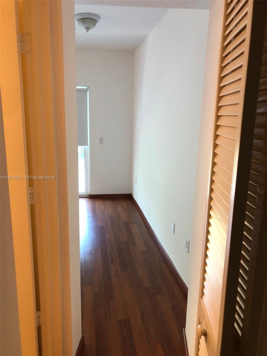 1650 Brickell Avenue, Unit 111 Miami, FL 33129 - Photo 18 of 23 a view of a hallway with wooden floor