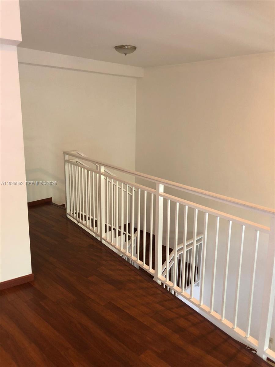 1650 Brickell Avenue, Unit 111 Miami, FL 33129 - Photo 6 of 23 a view of a hallway with wooden floor