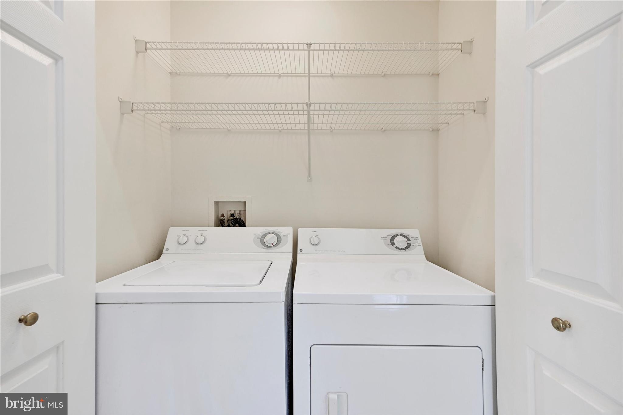13 Brook Farm Court, Unit 13L Perry Hall, MD 21128 - Photo 22 of 31 a utility room with dryer and washer